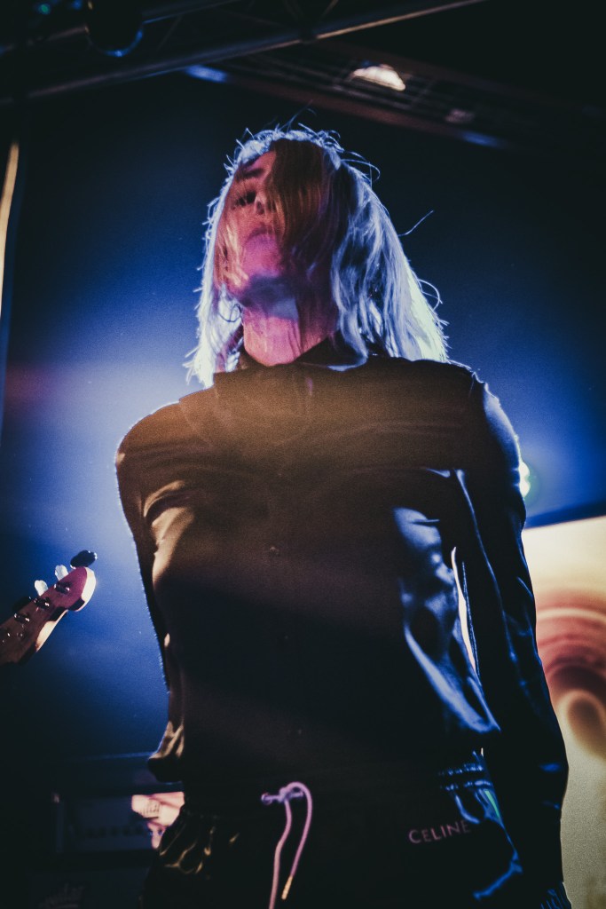 Kim Gordon performing on stage at Den Atelier, Luxembourg
