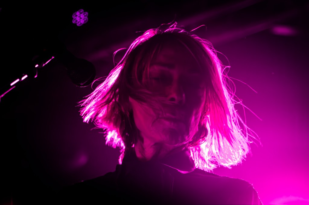 Kim Gordon performing on stage at Den Atelier, Luxembourg