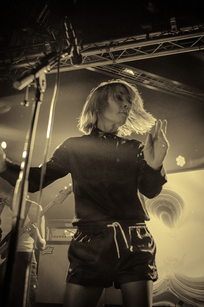 Kim Gordon performing on stage at Den Atelier, Luxembourg