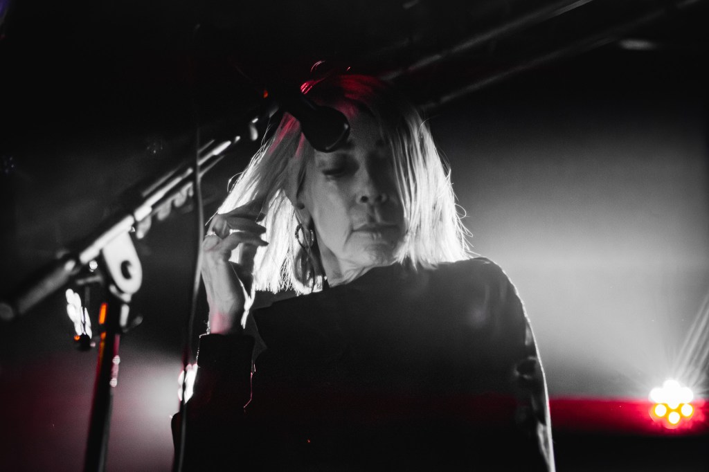 Kim Gordon performing on stage at Den Atelier, Luxembourg
